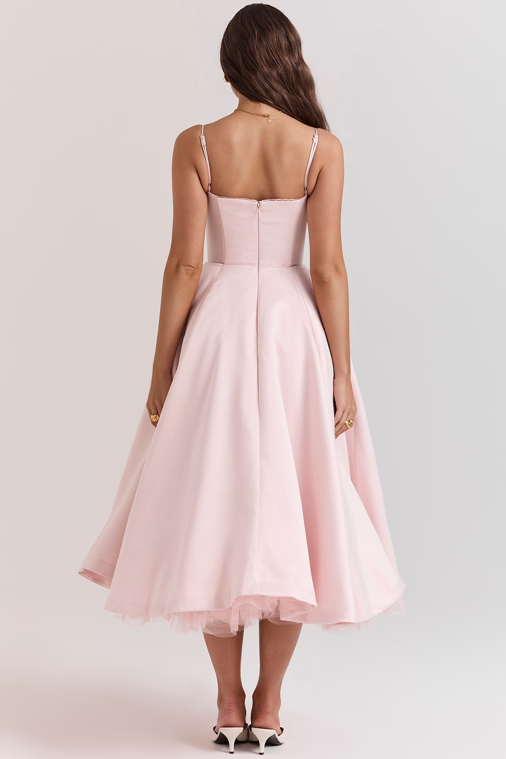 Women's elegant party dress, a midi length with a sophisticated corset top and flowy skirt.