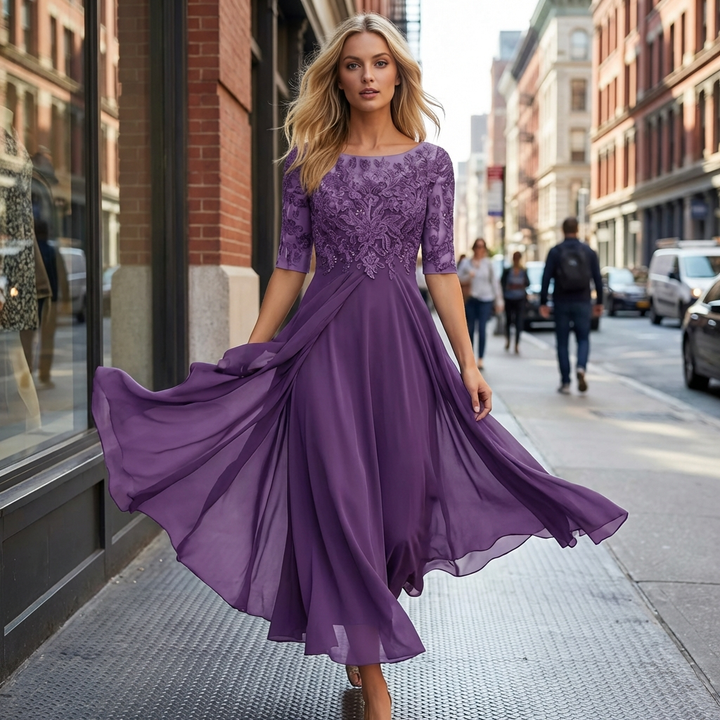 Sophisticated women's flowing midi dress with round neck & three-quarter sleeves for wedding guests.