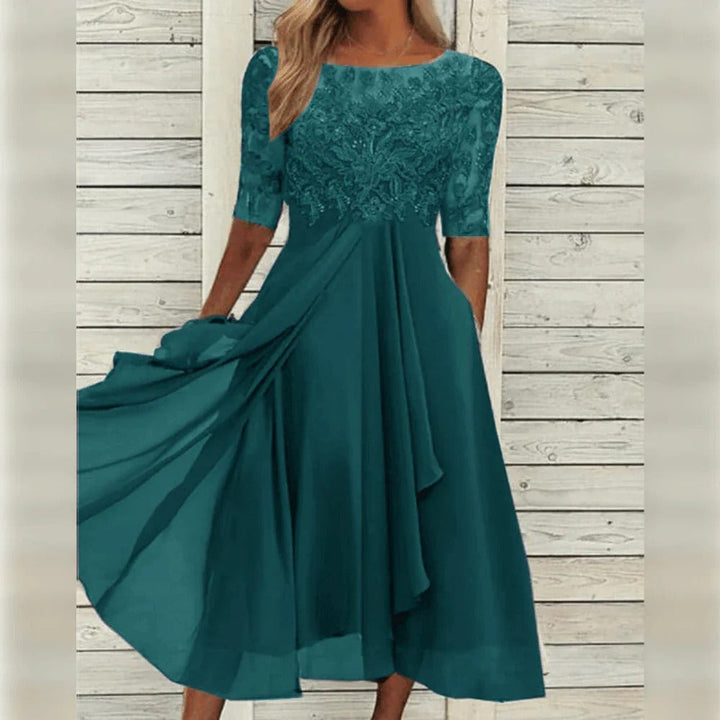 Flowing round neck midi dress for women. A sophisticated and elegant choice for formal evening events.