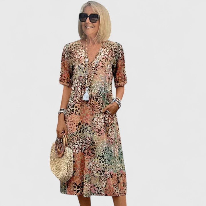 Elegant women's midi dress, perfect for stylish summer occasions. Flattering A-line fit & comfortable flowy fabric.