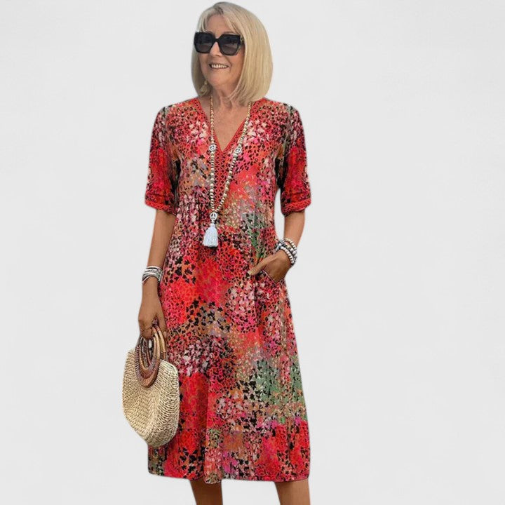 Flowy women's elegant midi dress, designed for effortless style. A comfortable, flattering option for any summer occasion.