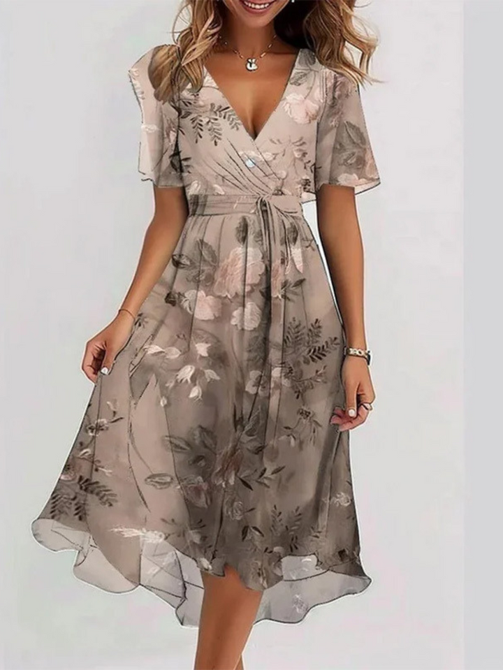 Elegant women's midi dress, perfect for summer. Features comfortable fabric and flattering belly coverage.