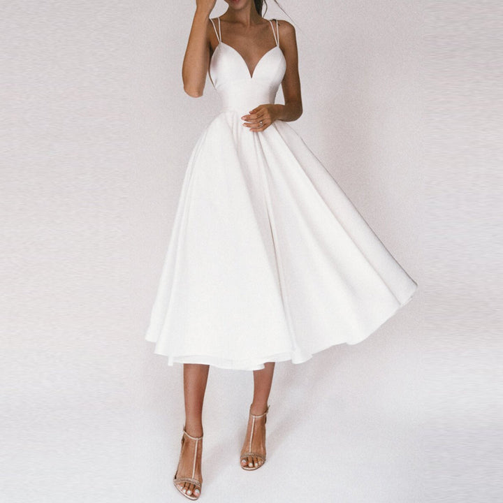 Elegant women's midi dress with a flattering fit and flare silhouette and stylish strap detail.