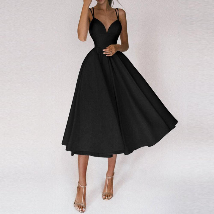 Fashionable women's summer midi dress with a flared skirt and elegant strap design.