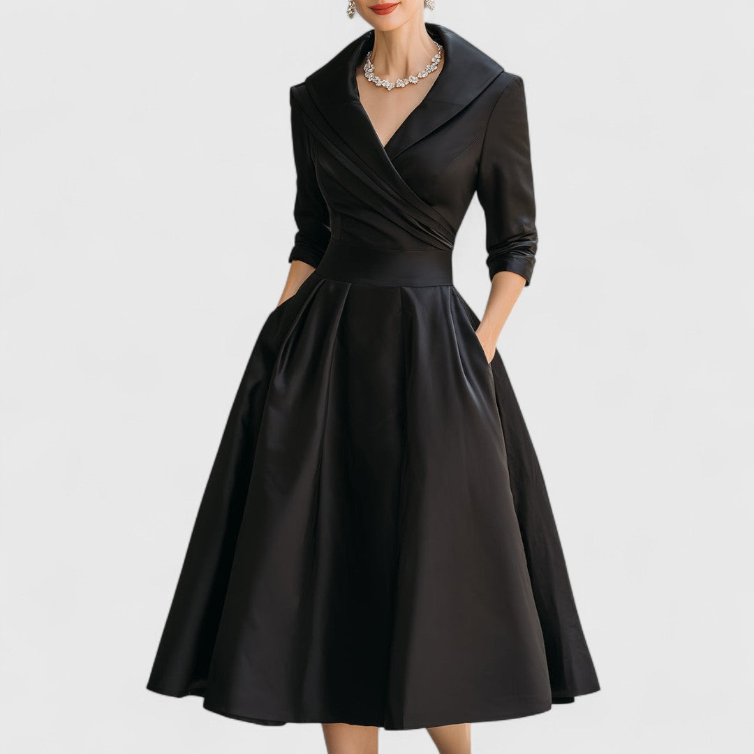 Elegant women's midi dress with a graceful silhouette, perfect for sophisticated occasion wear. Sleeveless, classic style.