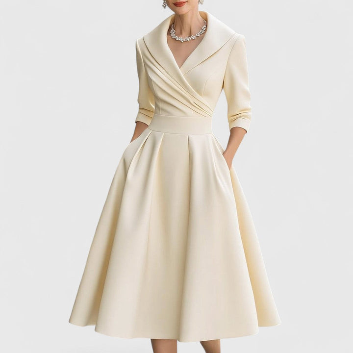 Sophisticated women's sleeveless midi dress. Elegant, graceful silhouette, ideal for classic and versatile occasion wear.