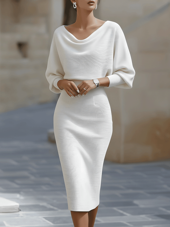 Women's elegant casual midi dress with a round neck and flowy batwing sleeves.