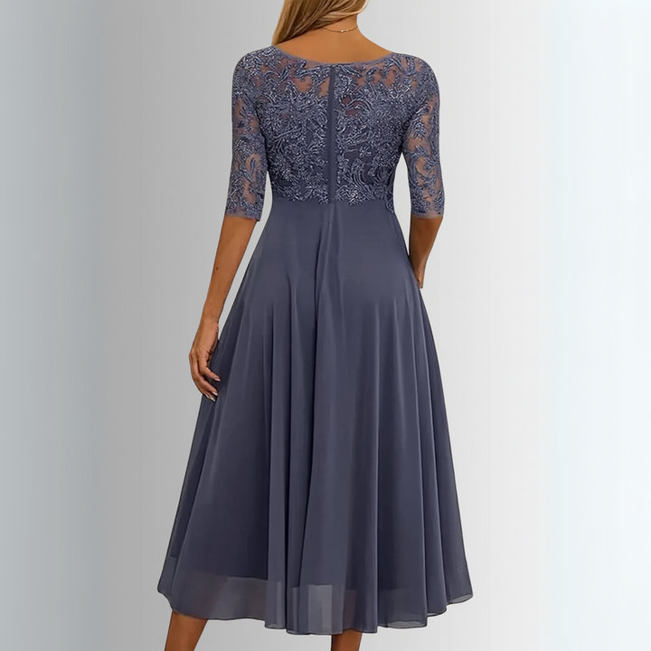 Party-ready women's lace midi dress, half-sleeve, with a beautiful flowing skirt, offering comfort and style.