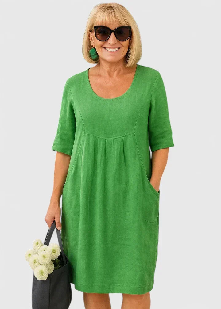 Elegant women's midi dress with half sleeves & scoop neck. Perfect for comfortable everyday wear, includes pockets.