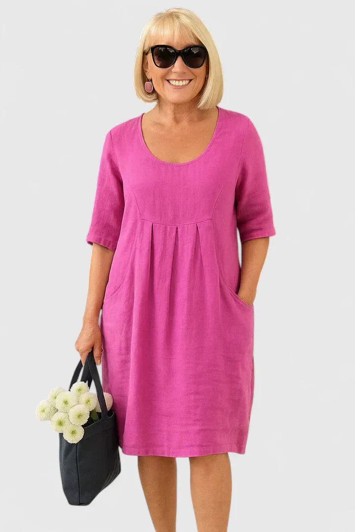 Comfortable women's everyday midi dress with practical pockets & stylish half sleeves. Scoop neck, casual style.