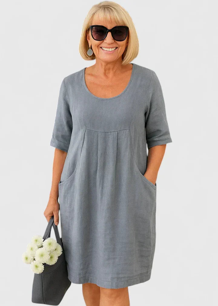 Everyday elegant women's midi dress with half sleeves, scoop neck. Comfortable summer casual wear with pockets.