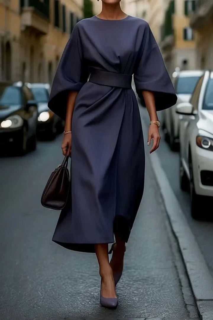 Sophisticated women's midi dress featuring stylish lantern sleeves and a flattering tie-waist wrap front.