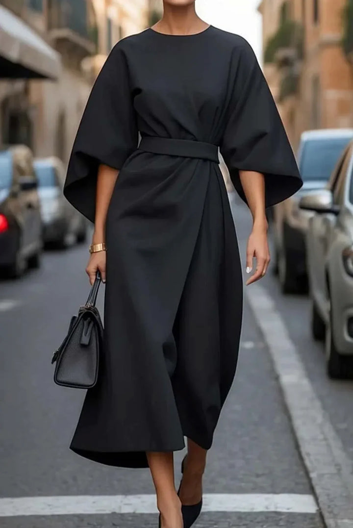 Women's round neck midi dress with elegant lantern sleeves, tie-waist, and a stylish wrap front design.