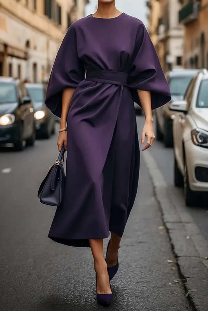 Chic women's midi dress with long lantern sleeves, an adjustable tie-waist, and a graceful wrap design.