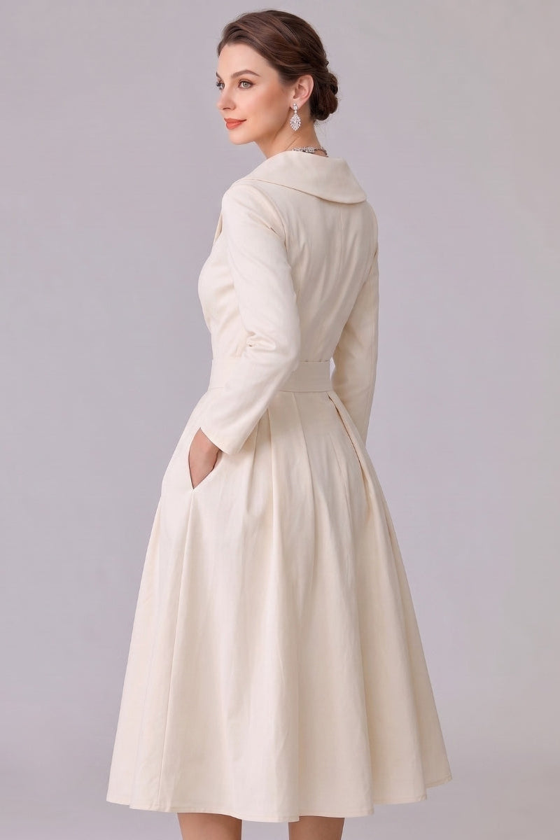 Modest long sleeve midi dress for women, featuring a timeless elegant design & functional pockets.