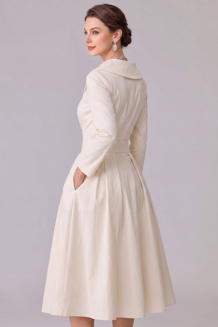 Modest long sleeve midi dress for women, featuring a timeless elegant design & functional pockets.