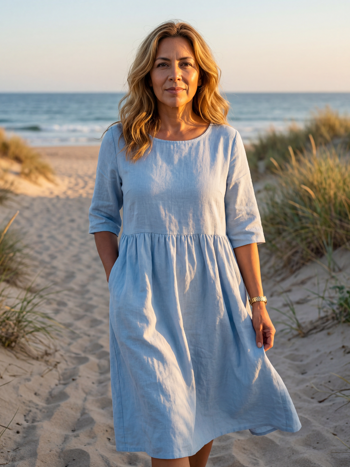 Elegant women's midi dress with relaxed fit, round neck, & half sleeves. Perfect for comfortable everyday style or spring fashion.