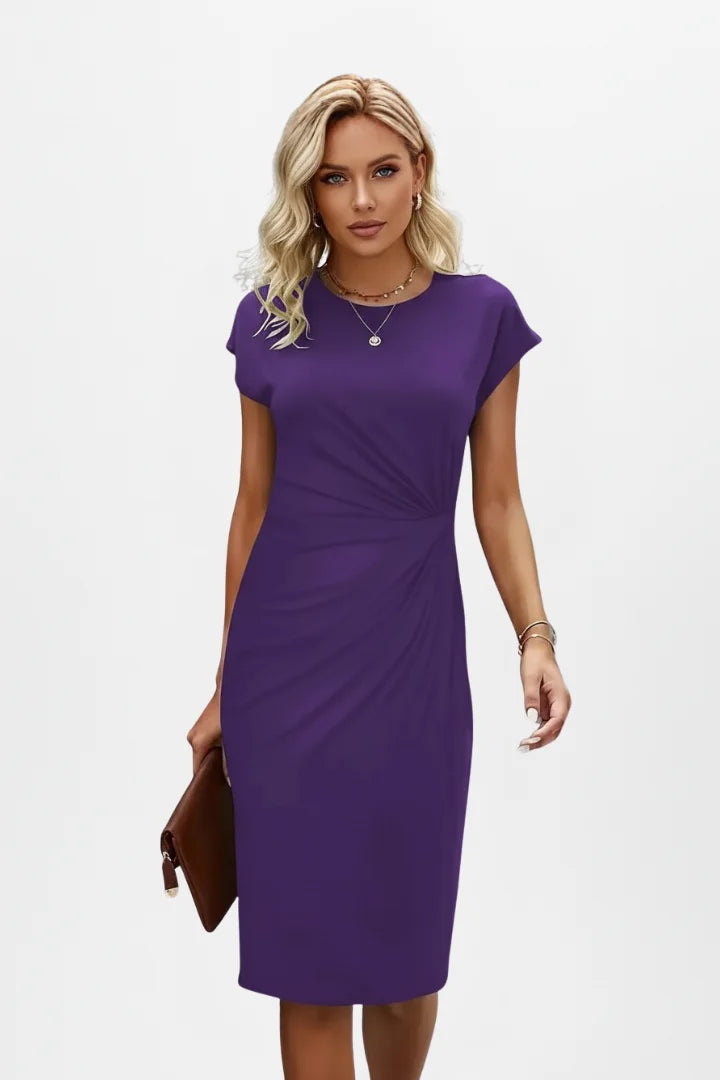 Women's midi dress showing elegant ruched waist, cap sleeves. Ideal for work, party, or casual chic.