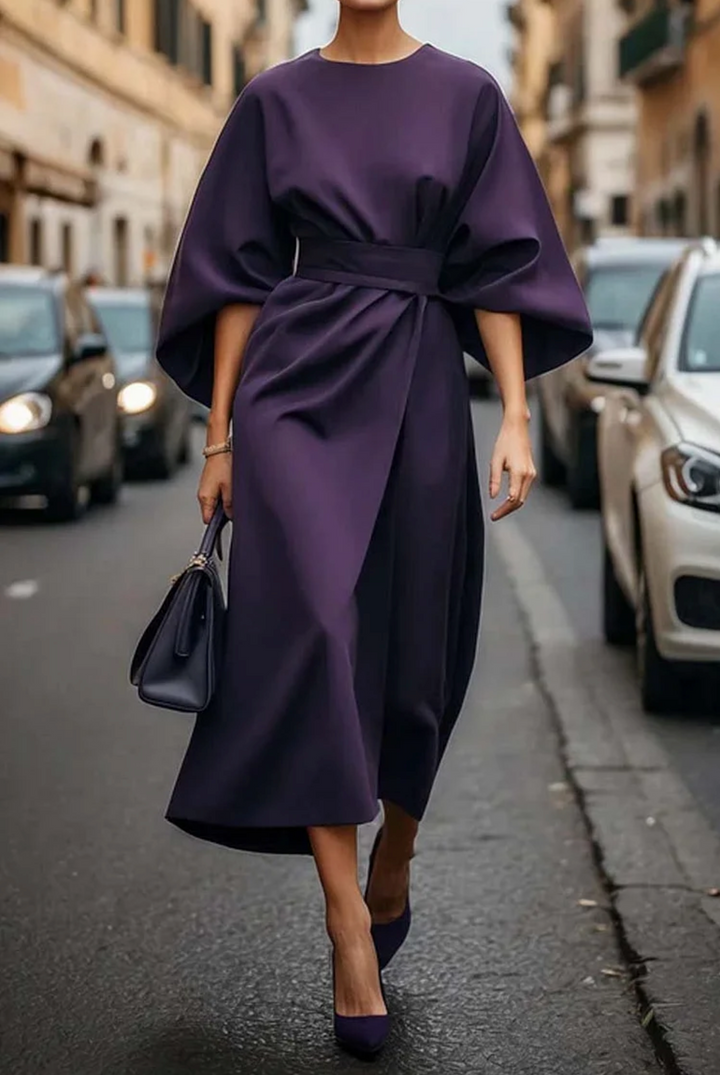 Stylish women's lantern sleeve dress, a versatile midi length design with a flattering waist tie detail.