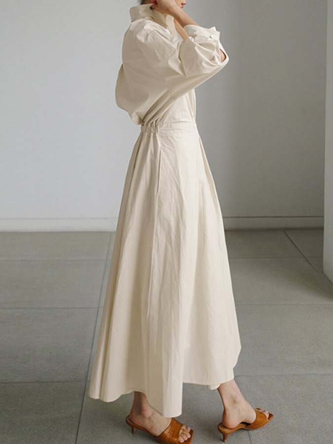 Women's fashion midi dress: sophisticated button-front shirt style, ideal for daywear.