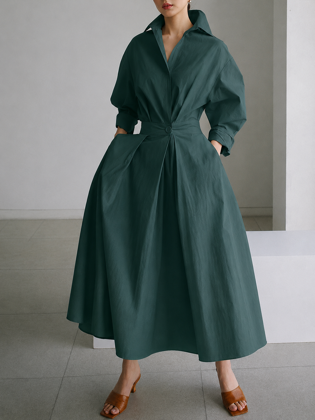 Sophisticated women's long-sleeve midi dress. Elegant button-front shirt style for modern women.