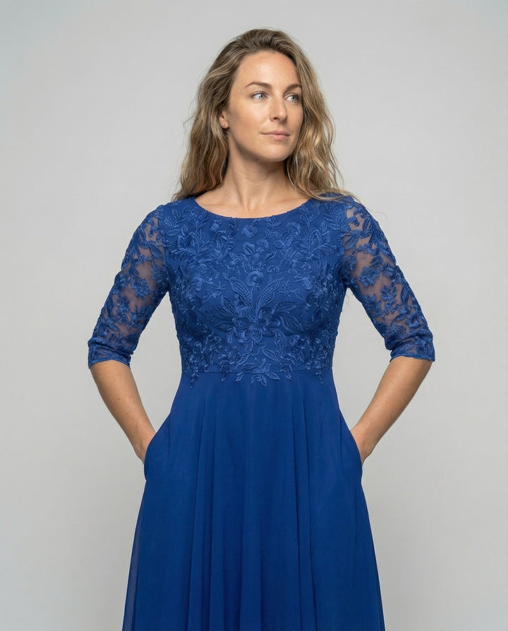Elegant women's midi dress with embroidered details, ideal for wedding guests and formal parties.