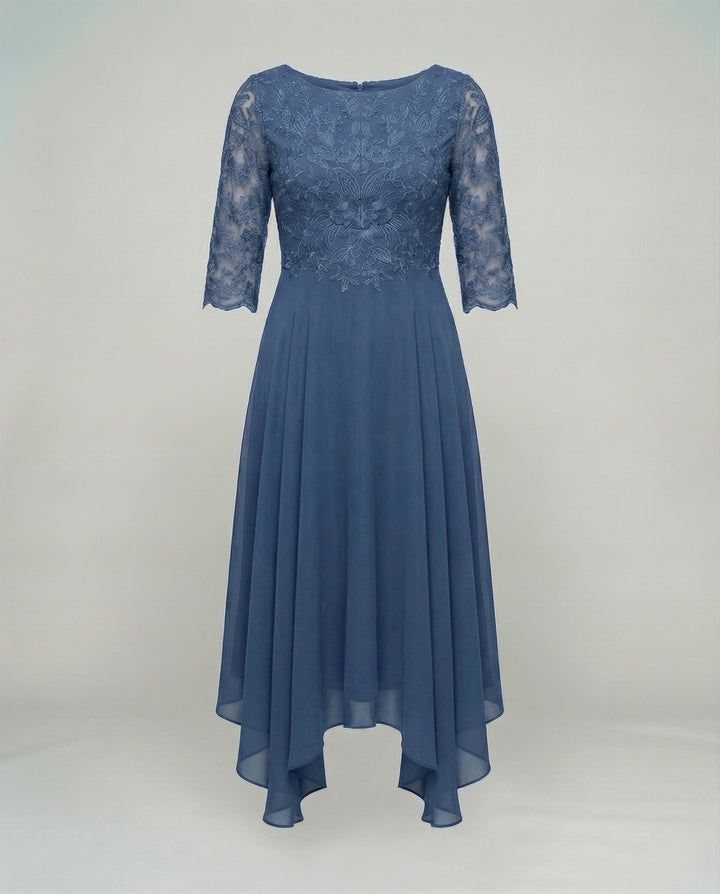 Flowy embroidered midi dress for women, perfect as a comfortable wedding guest outfit.