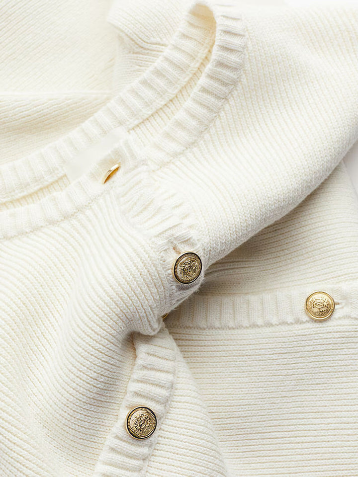 Versatile women's mini dress with elegant gold button detailing, a chic essential for modern wardrobes.