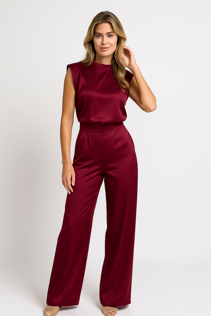 Chic sleeveless mock neck wide leg jumpsuit with open back, ideal for special occasions.