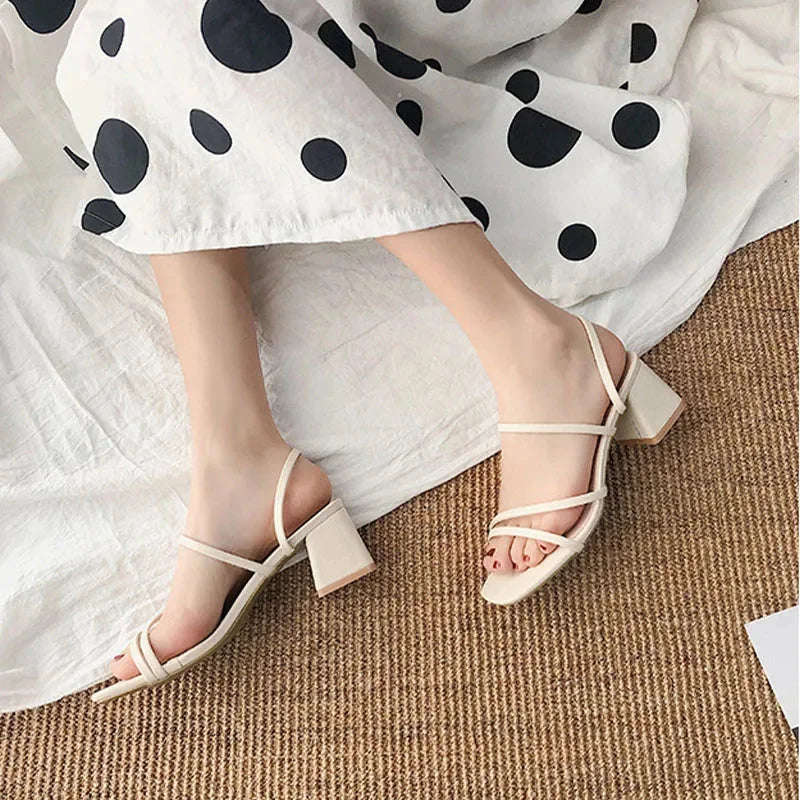Modern women's multi-strap sandals, featuring a stylish square toe and comfortable block heel for any event.