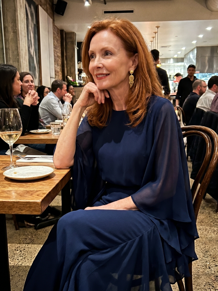 Elegant women's flowy navy midi dress with sophisticated layered sleeves & a flattering drape waist.