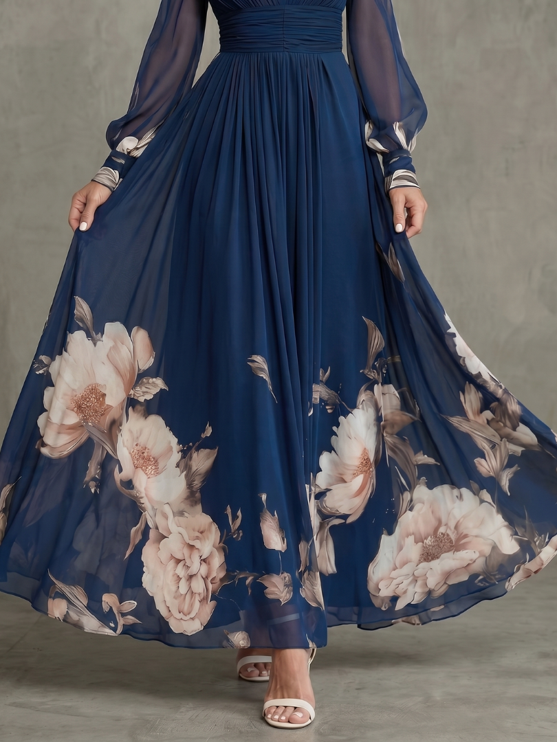 Modest navy maxi dress for women, designed with a flowy pleated skirt and sheer bishop sleeves.