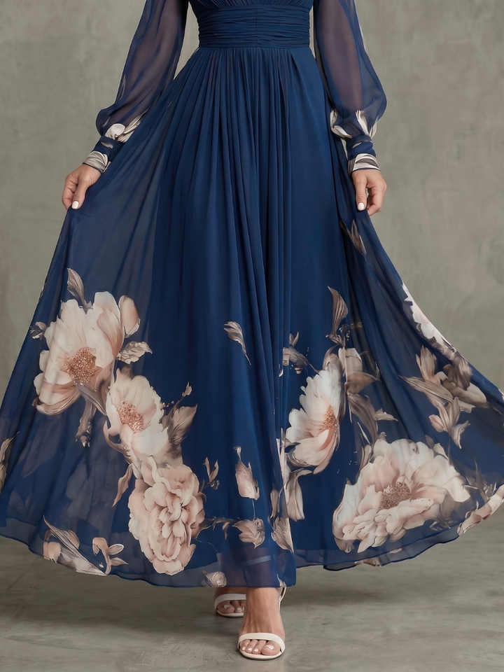 Modest navy maxi dress for women, designed with a flowy pleated skirt and sheer bishop sleeves.