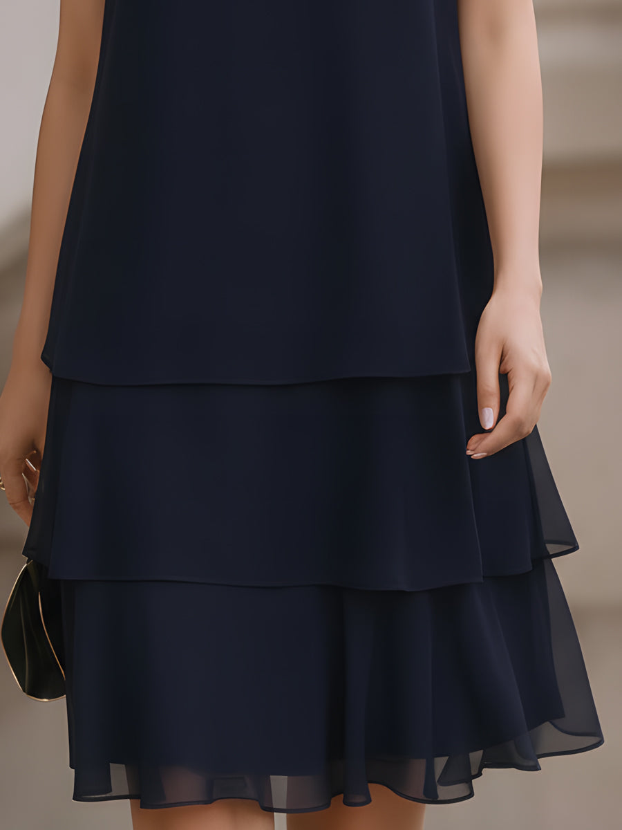 Chic women's navy sleeveless tiered shift dress for versatile summer wear, elegant occasions & comfortable style.