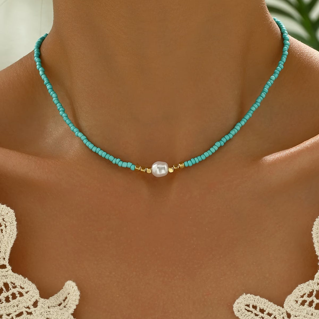 Elegant women's necklace featuring lustrous white pearls and vibrant turquoise stones, perfect fashion jewelry.