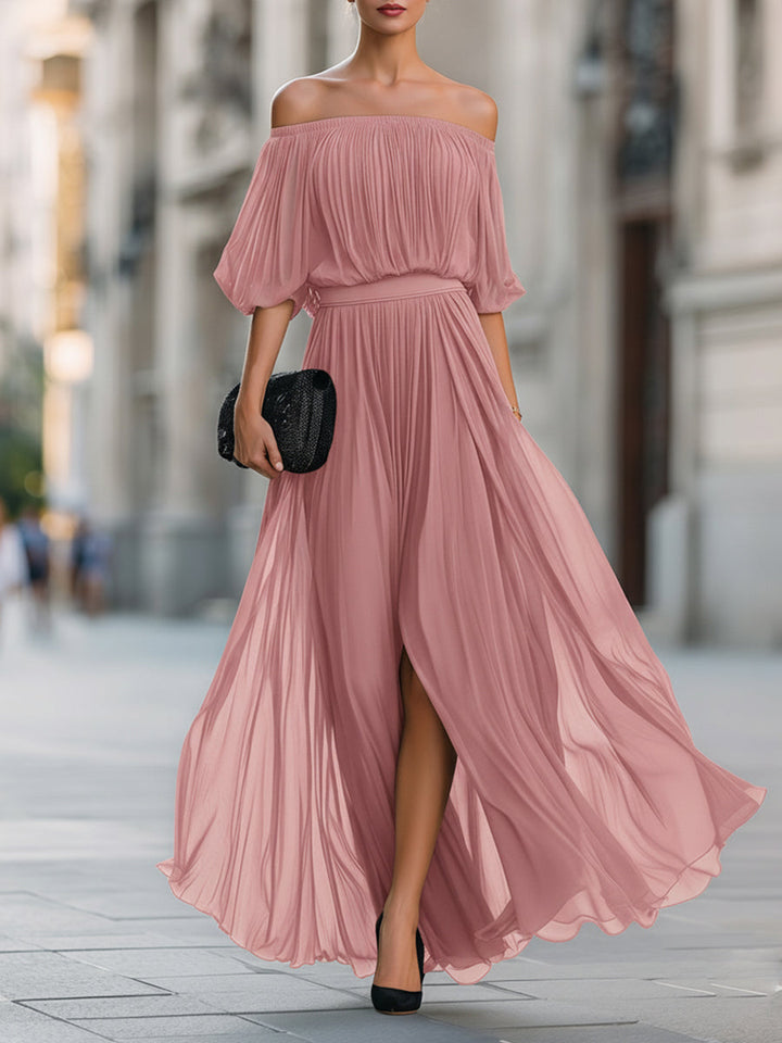 Full-length view of a women's off-shoulder pleated maxi dress, ideal for any special occasion.