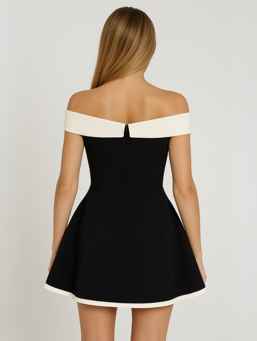 Flattering women's off-shoulder mini dress with elegant contrast details. Perfect for special occasion parties.