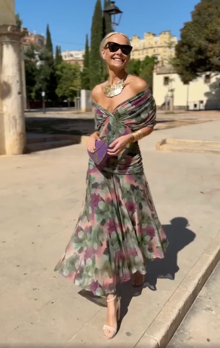 Women's elegant floral off-shoulder maxi dress for a summer garden party or evening event.