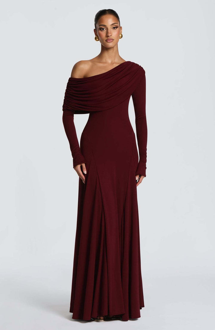 Stunning off-shoulder maxi dress for women, designed as an elegant wedding guest or bridesmaid formal evening gown.
