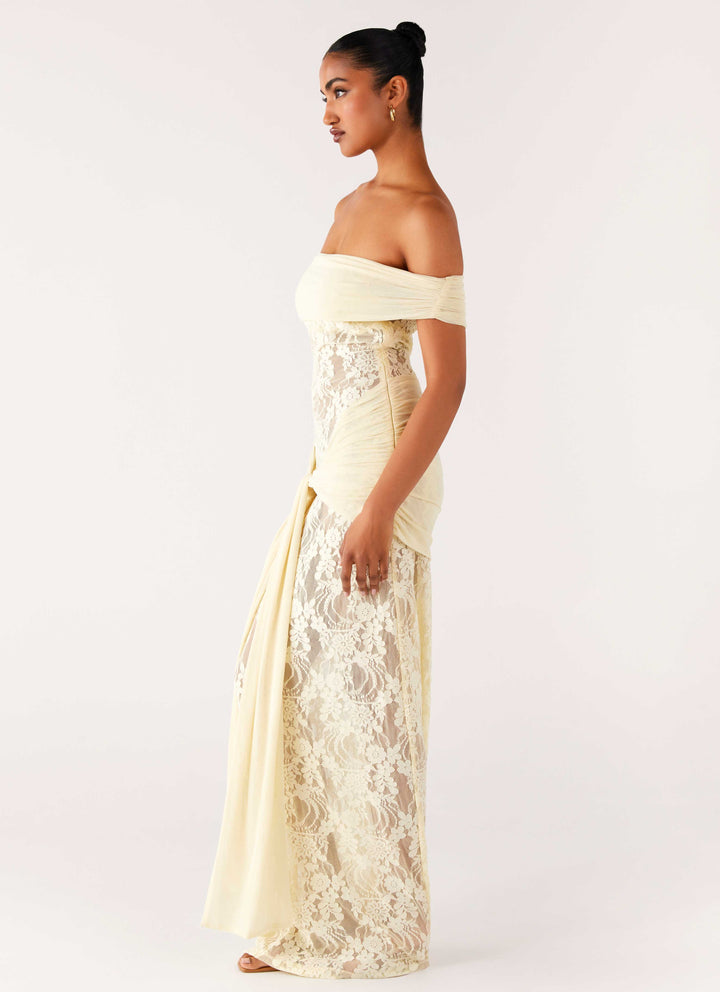 Back view of elegant women's off-shoulder maxi dress, showcasing the drape and lace for special occasions.