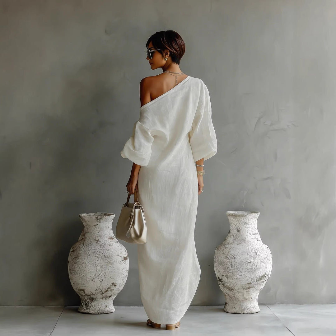 Women's elegant off-shoulder maxi dress with beautiful lantern sleeves, suitable for evening or resort wear.