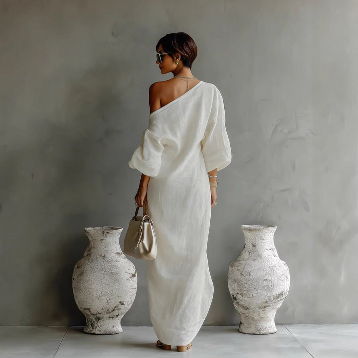 Women's elegant off-shoulder maxi dress with beautiful lantern sleeves, suitable for evening or resort wear.