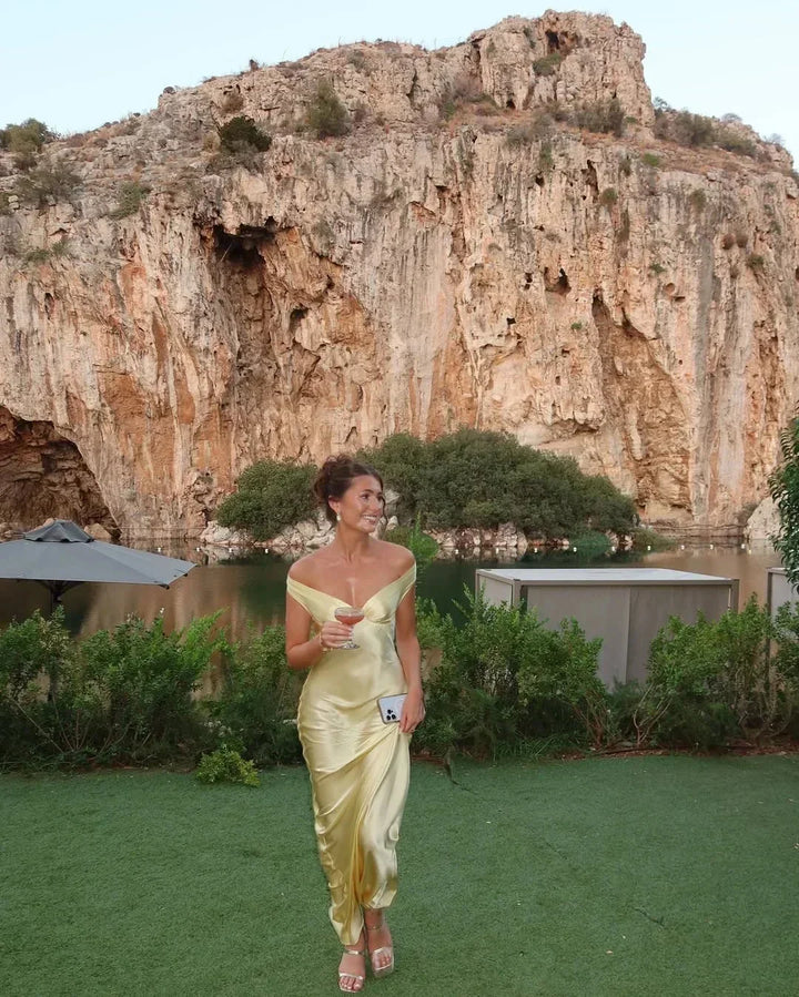 Women's elegant off-shoulder maxi evening dress, a stunning choice for formal wear & parties.