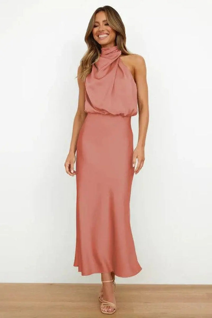 Chic midi cocktail dress with an elegant off-shoulder neckline, perfect for sophisticated party wear.