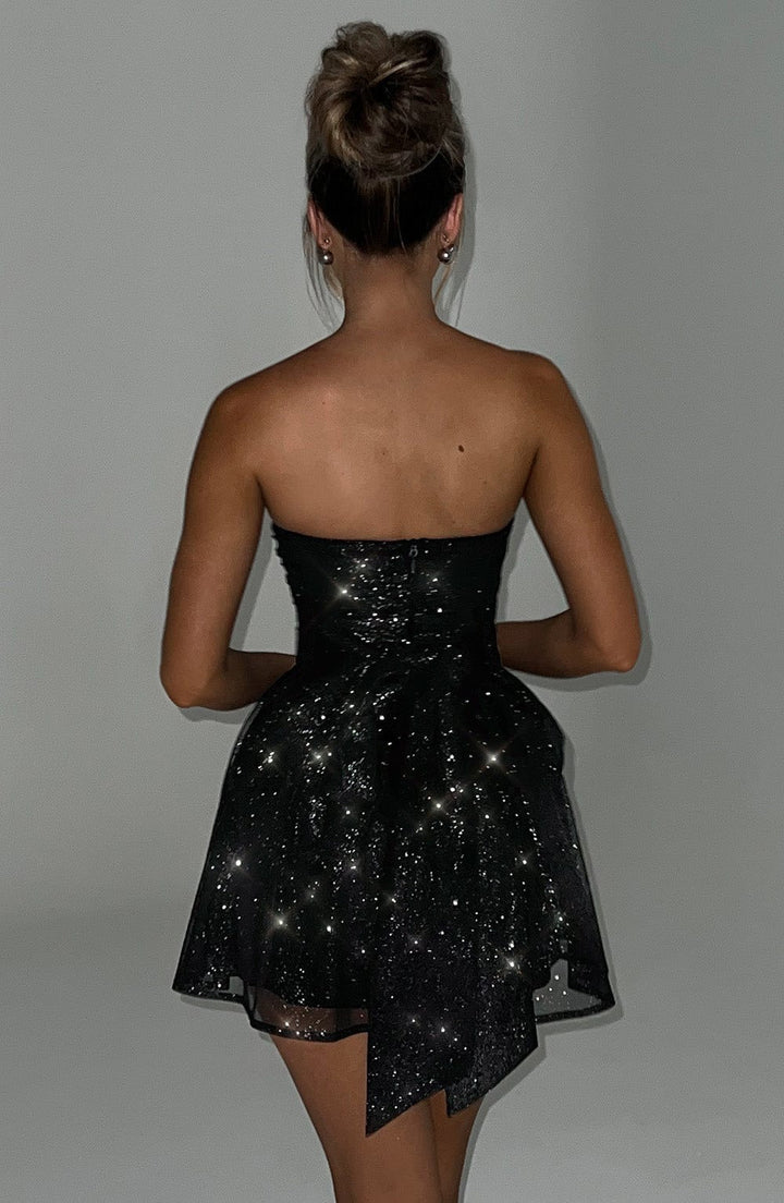 Sophisticated women's off-shoulder patchwork mini dress, perfect as an elegant party or cocktail outfit.