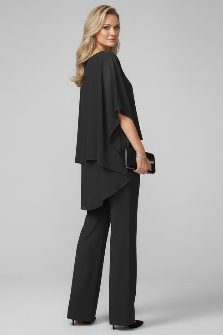 Women's flowing off-shoulder jumpsuit with wide legs. A versatile summer outfit for elegant comfort and party wear.