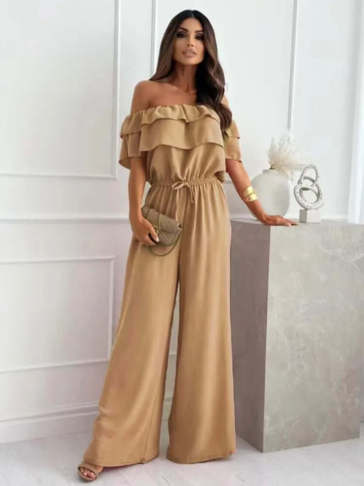 Chic blue off-shoulder wide-leg jumpsuit for women, featuring a comfortable and versatile design for summer evenings.