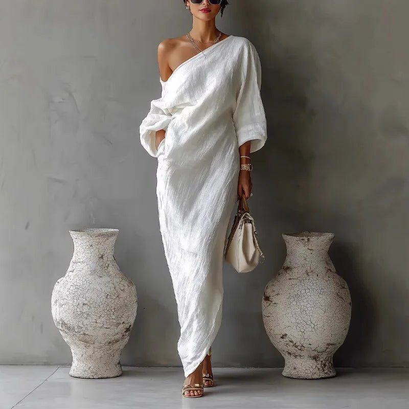 Elegant women's one-shoulder asymmetrical maxi dress in a flowy fabric, perfect for summer resort wear.