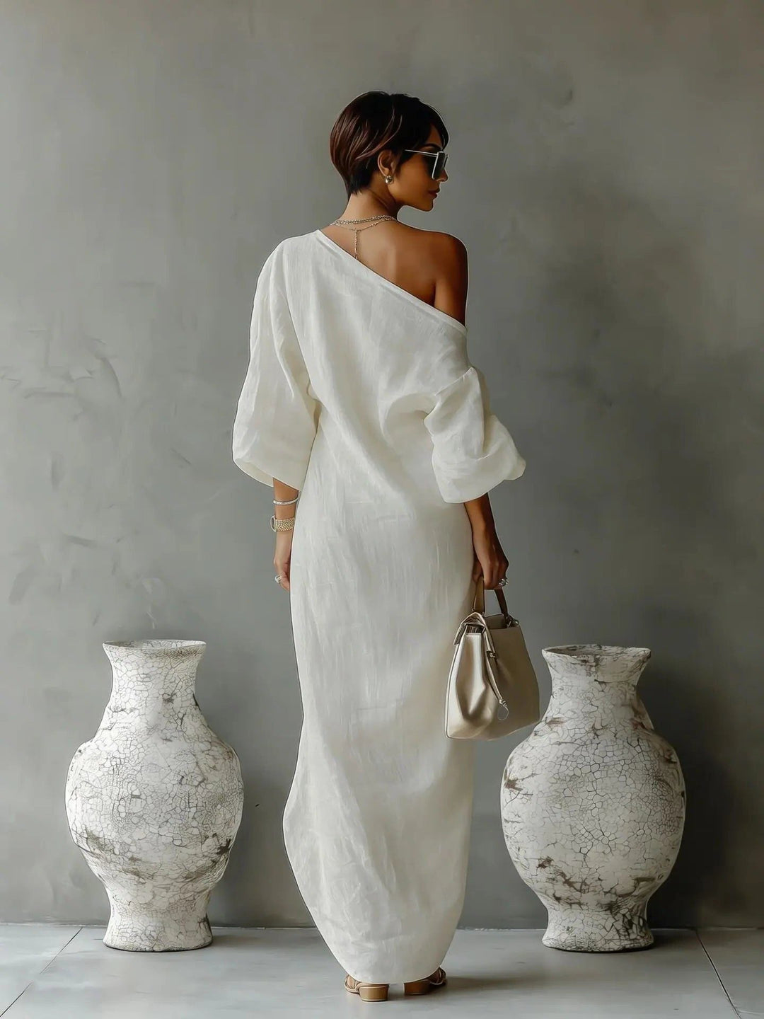 Flowy asymmetrical one-shoulder maxi dress for women with an elegant batwing sleeve, perfect for summer casual wear.