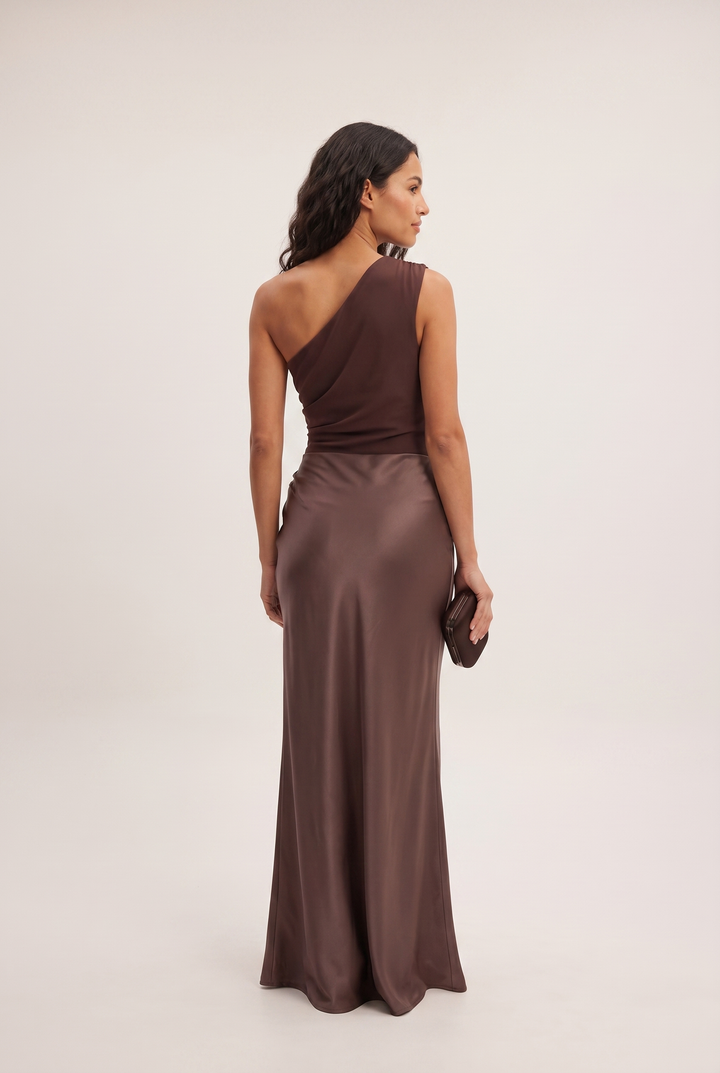 Beautiful women's one-shoulder draped maxi dress for an elegant, sophisticated evening look. Formal party gown.